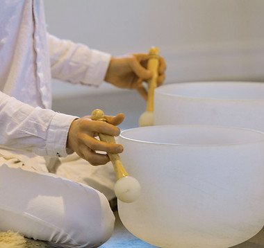 Playing-Crystal-Singing-Bowls