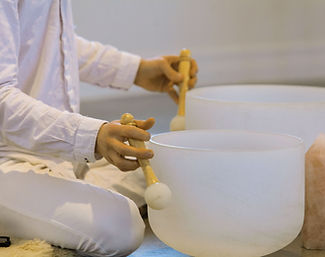 Playing-Crystal-Singing-Bowls