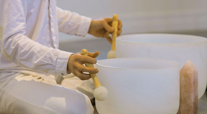 Playing-Crystal-Singing-Bowls