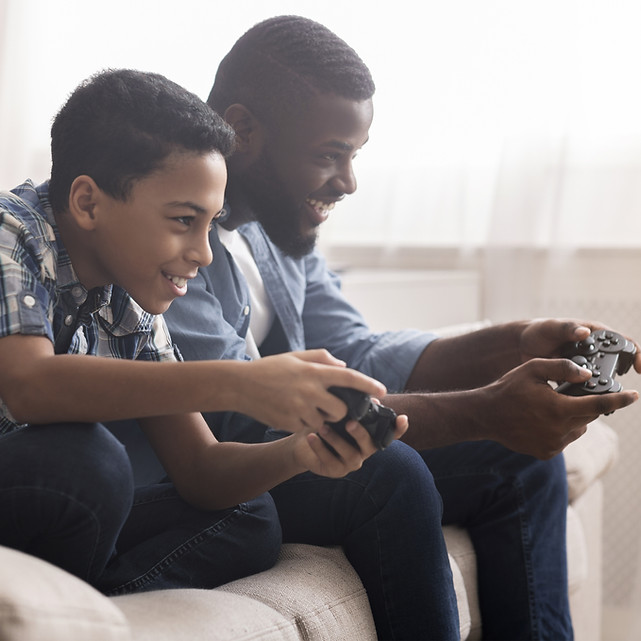 Ffather and son playing video games together