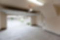 Empty garage with open door, looking from inside
