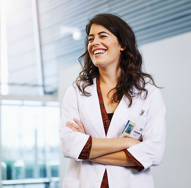 alt="Smiling medical professional"