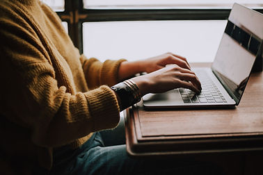 Typing on a laptop