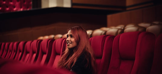 A woman watching a movie