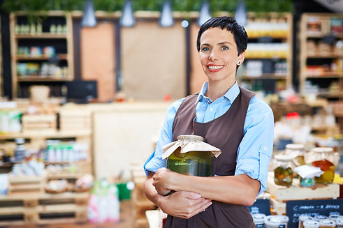 Female shop assistant in grocery store