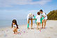Asian family volunteering for collecting garbage in the beach