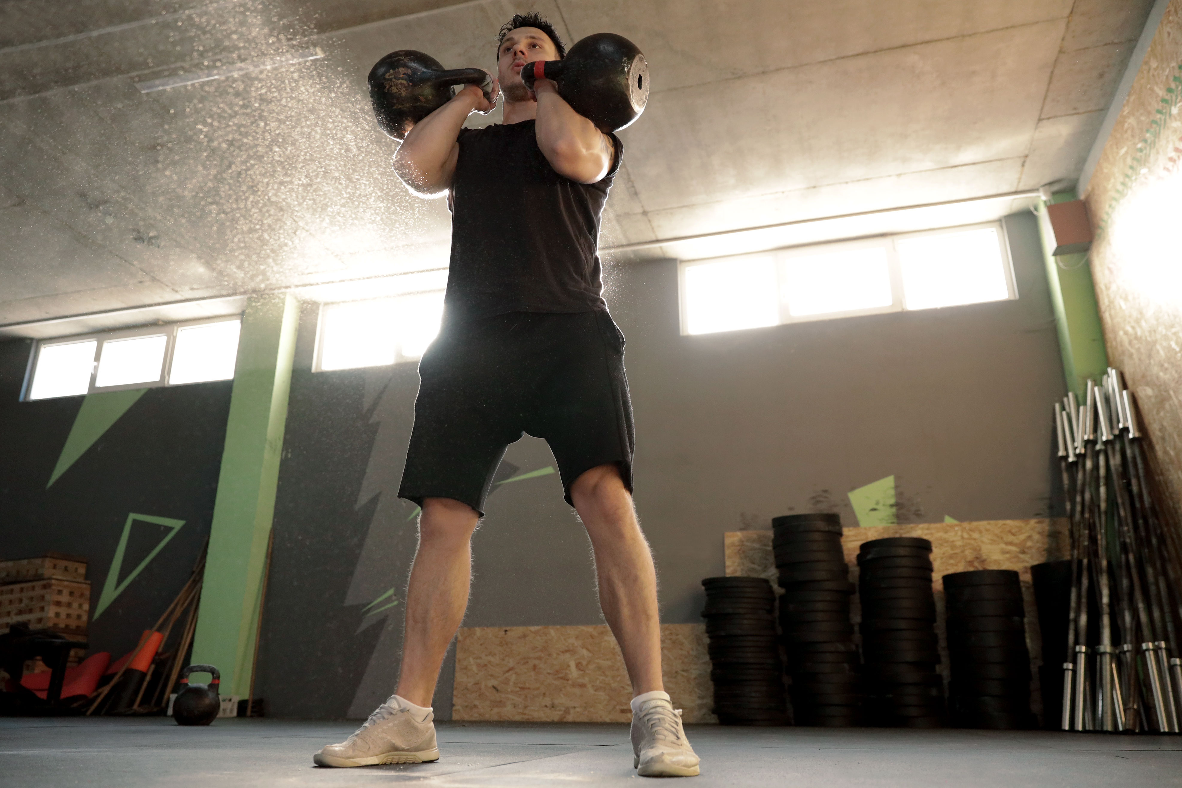 A man lifting weights in the gym