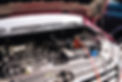 A professional changing a car battery