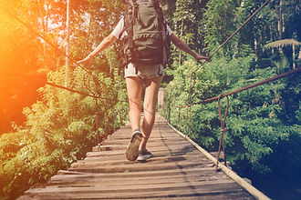 Backpacker On Bridge