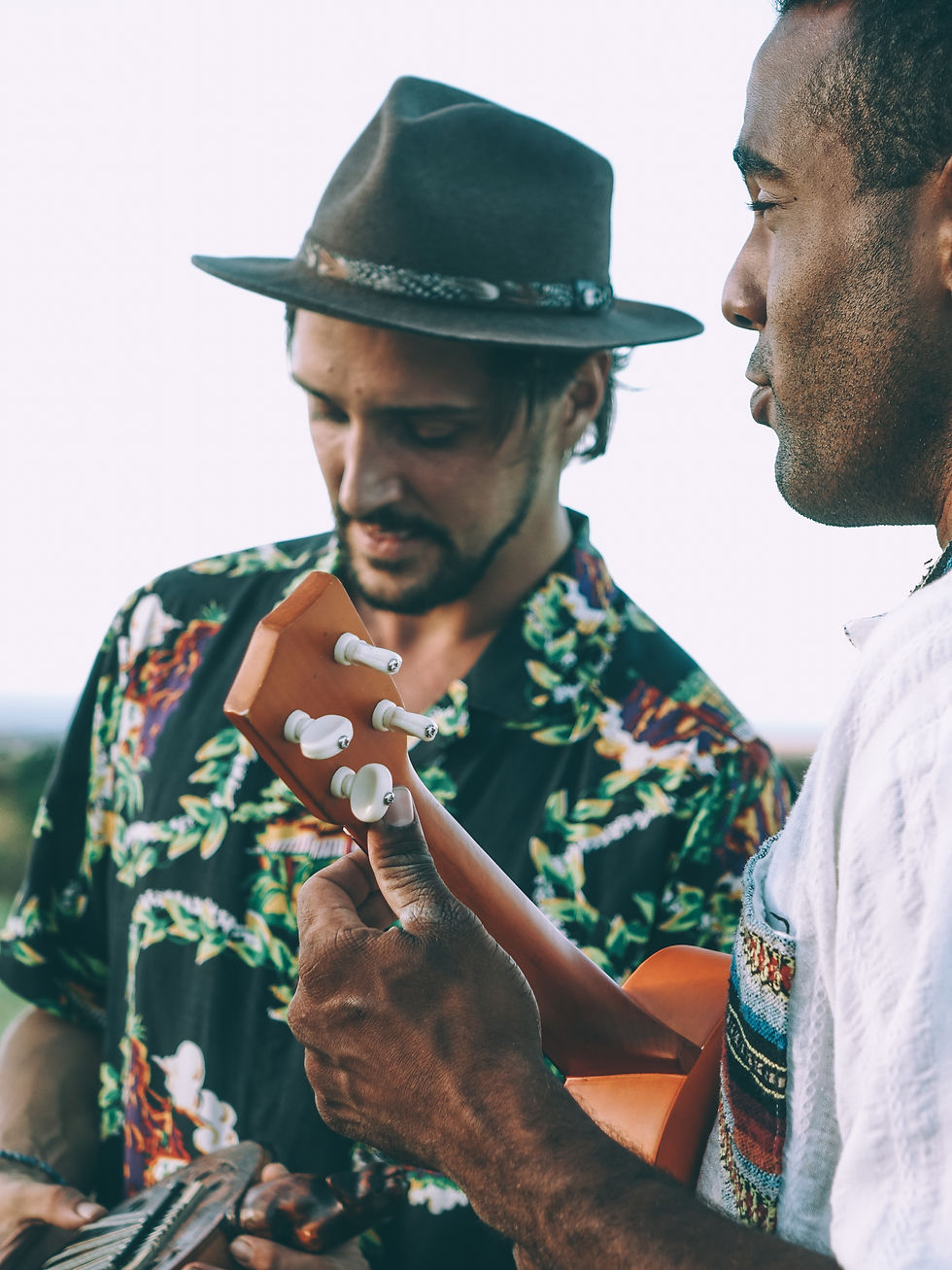 Two Men Playing Ukulele