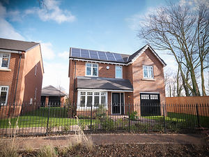 Energy efficient house with solar panels on roof