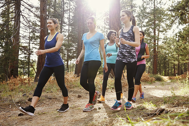 Group of women walking in the woods Walk Your Way to Gene‑Powered Health for fitness and health.