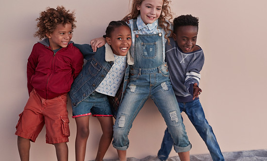 Cute Kids Posing Against Wall