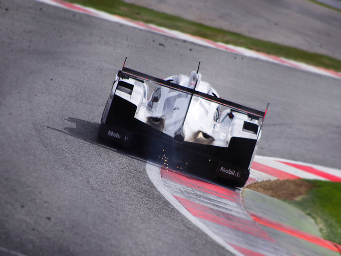 Racing car cornering on a track