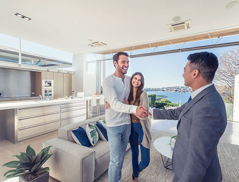 Couple meeting realtor in luxury home