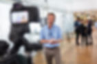 News reporter getting filmed
