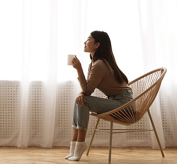 Woman Enjoying a Cup of Coffee