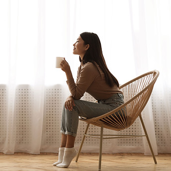 Woman Enjoying a Cup of Coffee