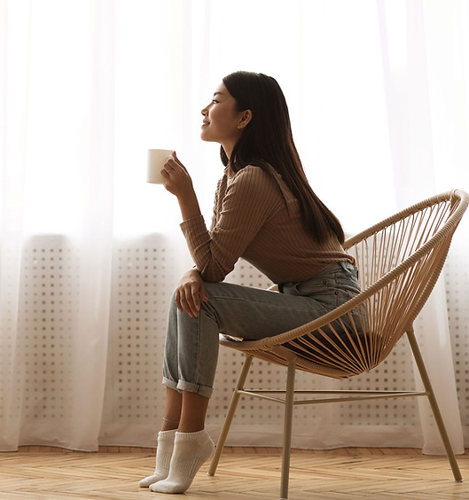 Woman Enjoying a Cup of Coffee