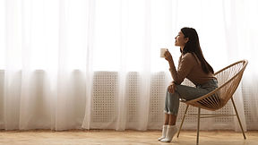 Woman Enjoying a Cup of Coffee