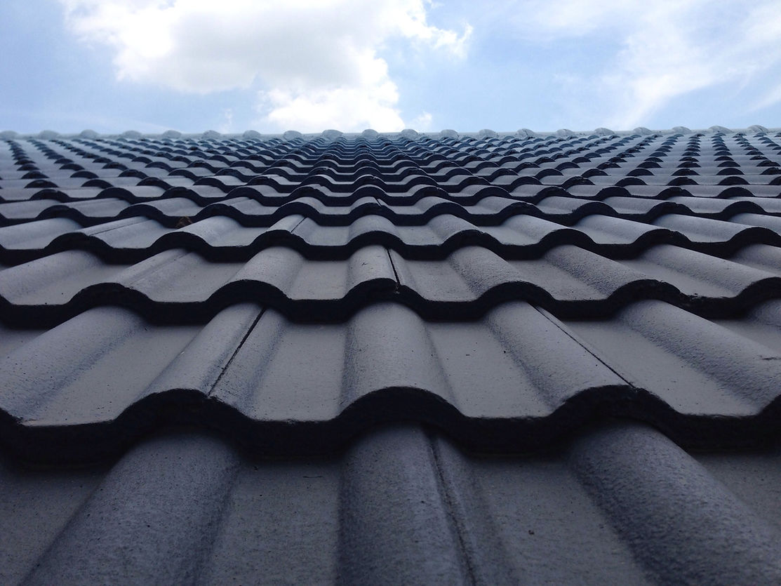 Close-up of a new dark tiled roof