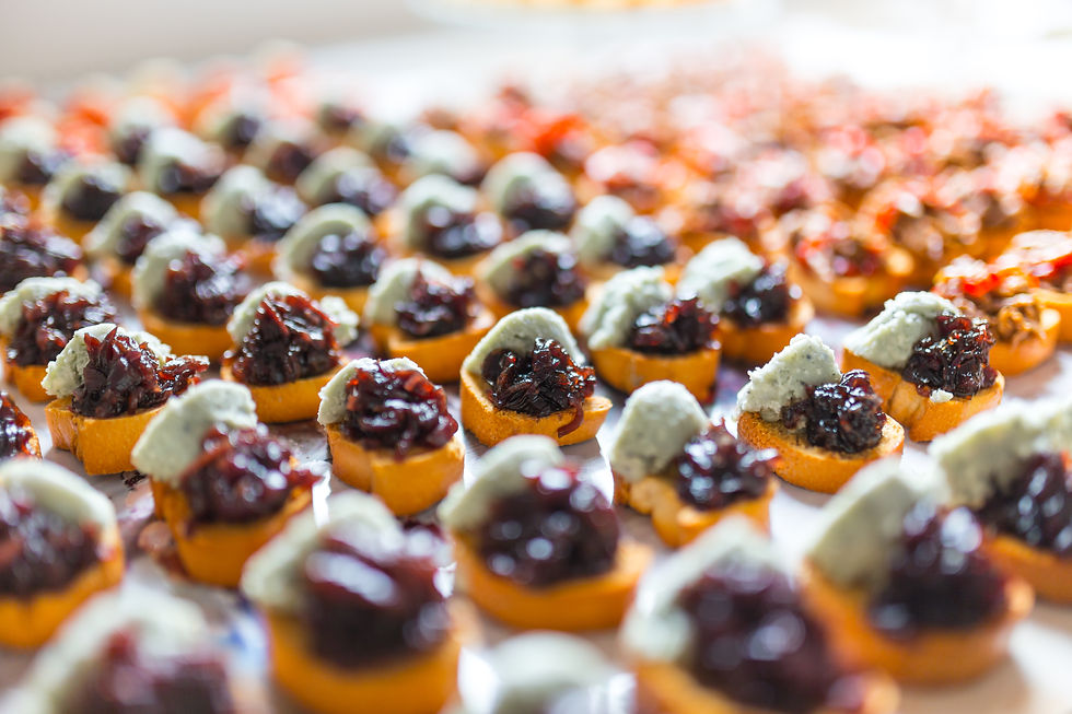 Closeup of a canape with pate and jam placed on a table