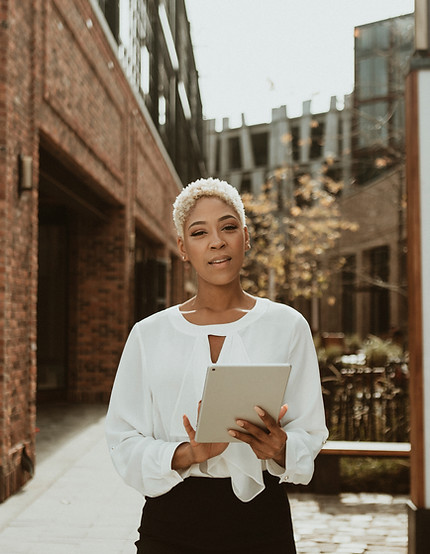 Woman Holding Tablet Outside