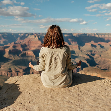 Woman Meditating at Canyon