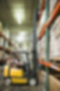 man operating forklift in warehouse