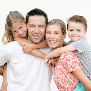 Family portrait, parents with their children on their back