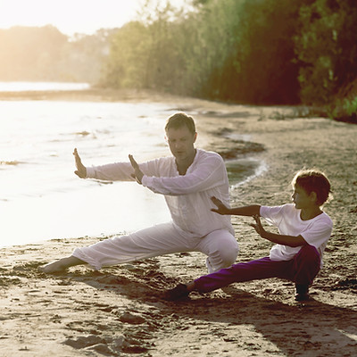 Practicing Tai Chi on the Beach