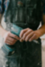 Worker holding power drill tightly