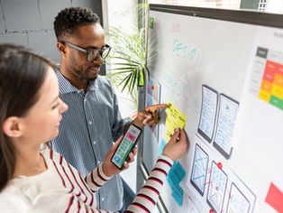 small business owners discussing and planning their marketing strategy