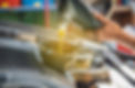close-up of a mechanic hands pouring oil into a car
