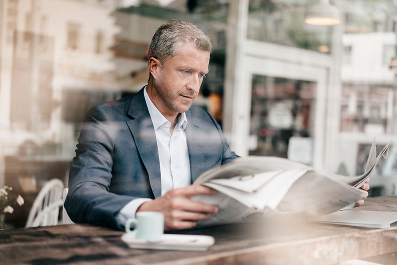 Man Reading Newspaper