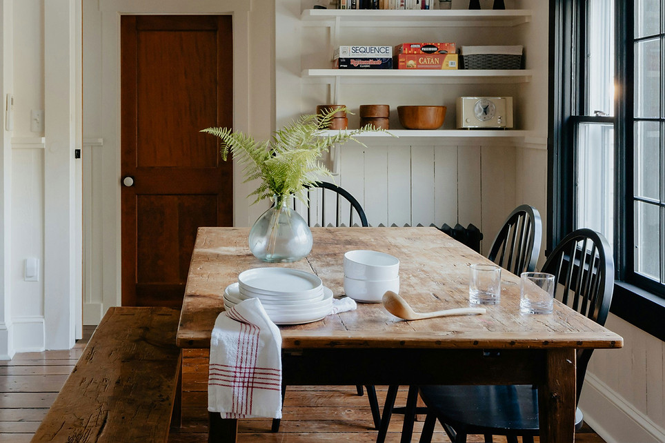 Warm, organised dining room showing a calm, functional family home that reflects professional organising and home function support.