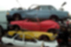 breakers yard with stacked cars