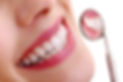 Smiling woman with dental mirror