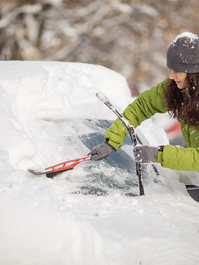 Scraping Snow Off Windshield