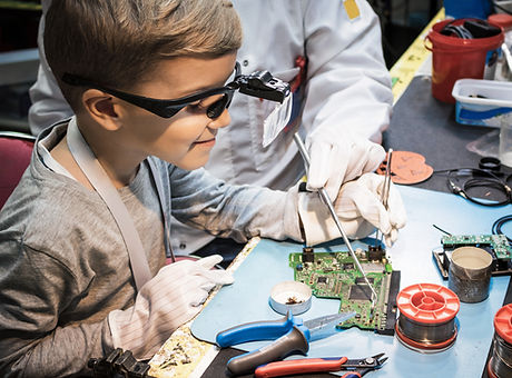 Boy Analyzing Circuit Board