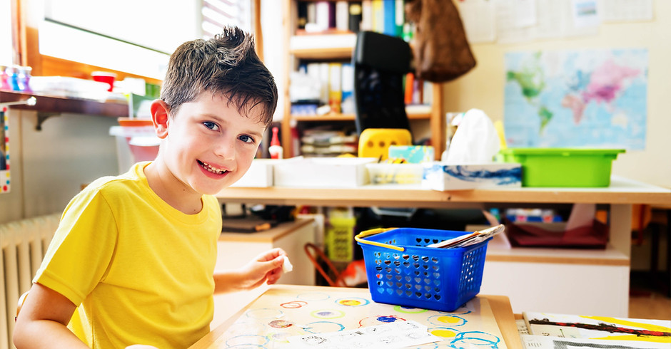 Child painting in school