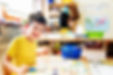 Child painting in school