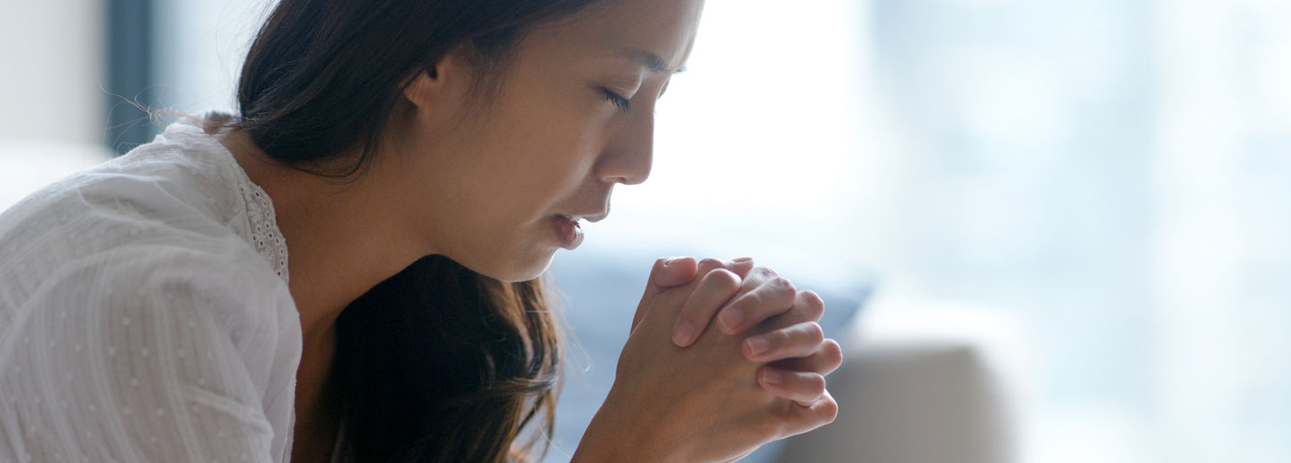 Lady praying.