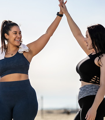 women's hormone specialist featuring two women high-fiving