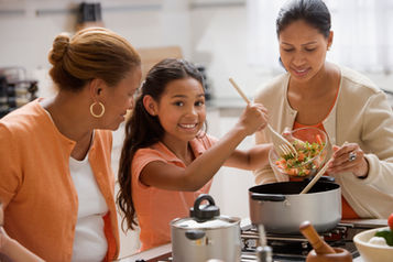 Mother and daughter cooking