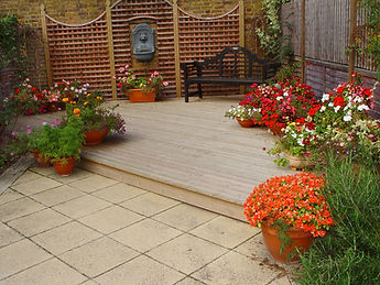 Garden Decking Patio with colourful planters