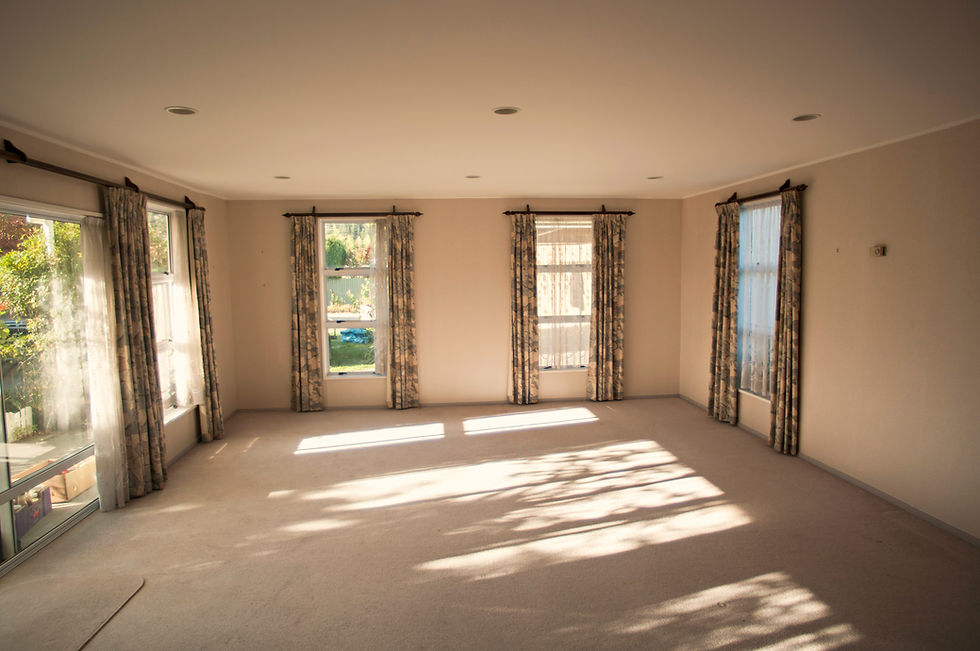 Bright empty room filled with natural sunlight and wooden floor