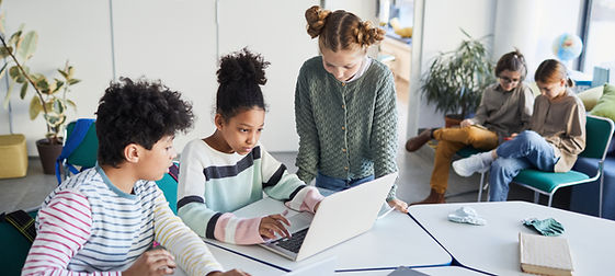 kids creating game in Roblox studio during coding camp