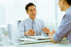 Asian manager giving advice in his office