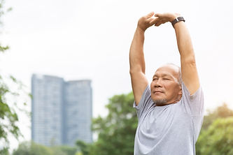 An old man stretching his arms